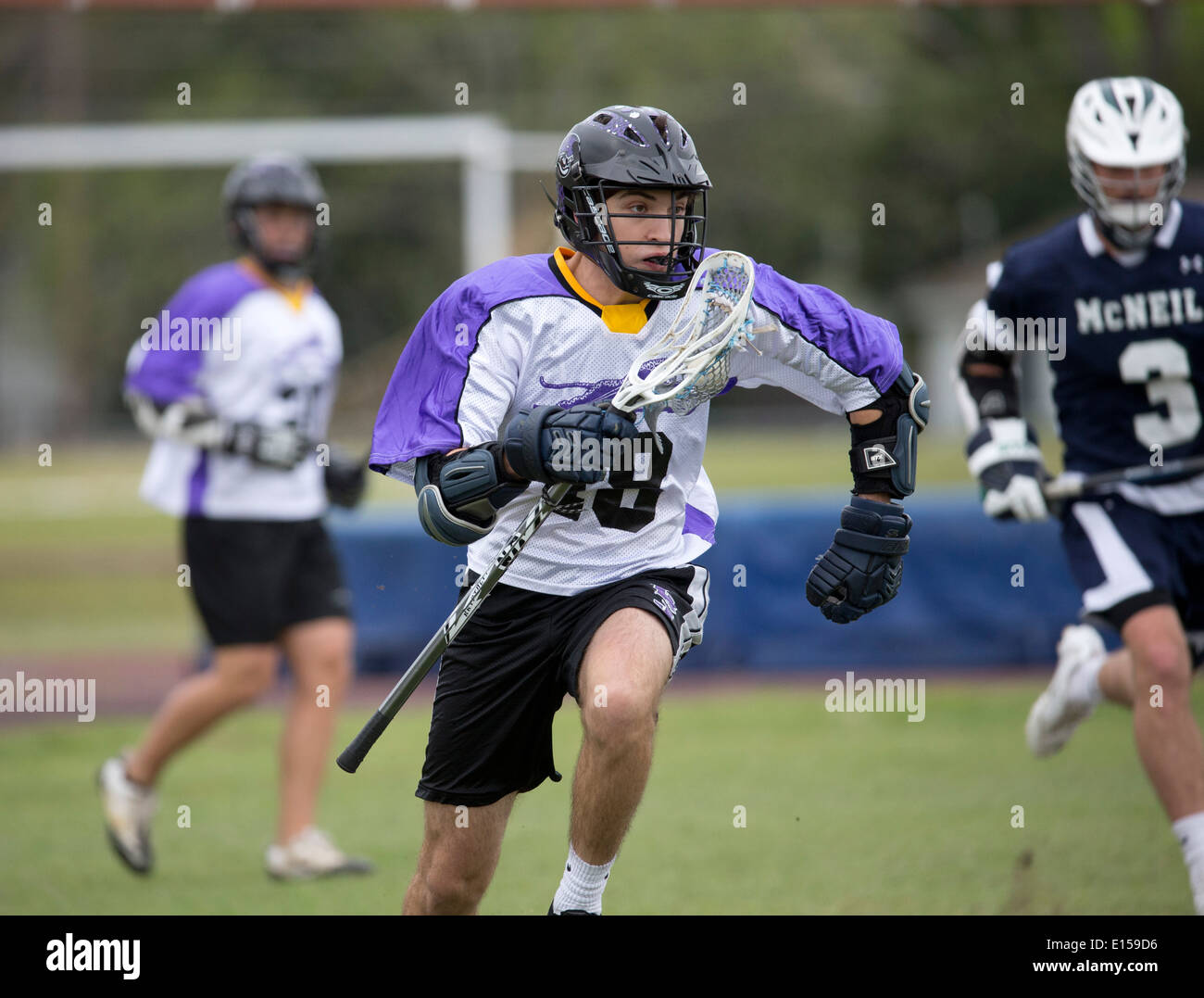 Texas high school boy's lacrosse action featuring LBJ High School