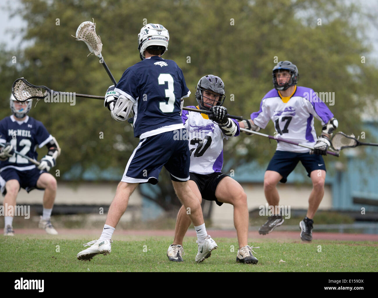 Texas high school boy's lacrosse action featuring LBJ High School