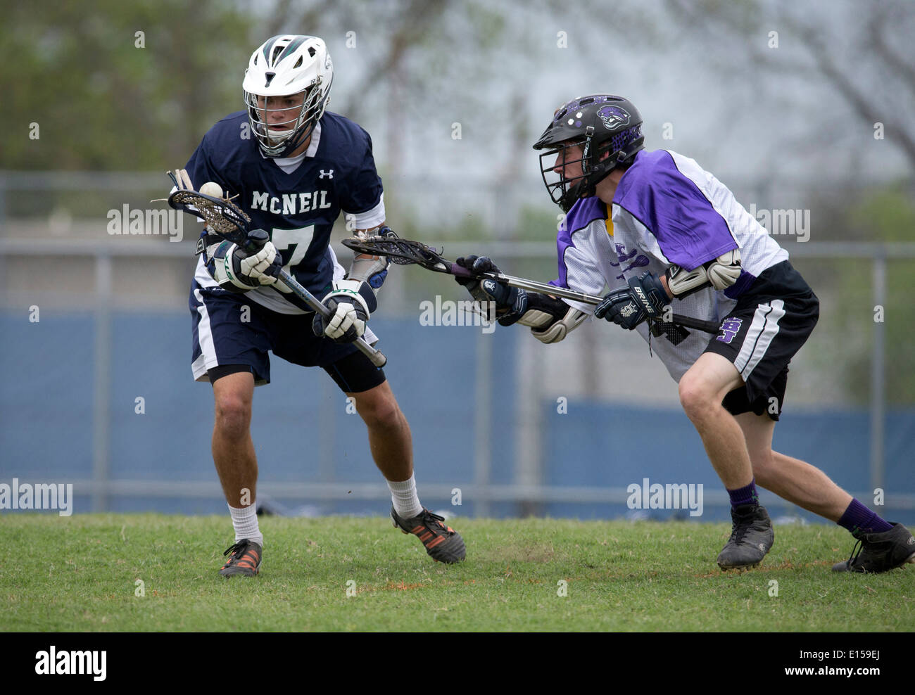 Texas high school boy's lacrosse action featuring LBJ High School