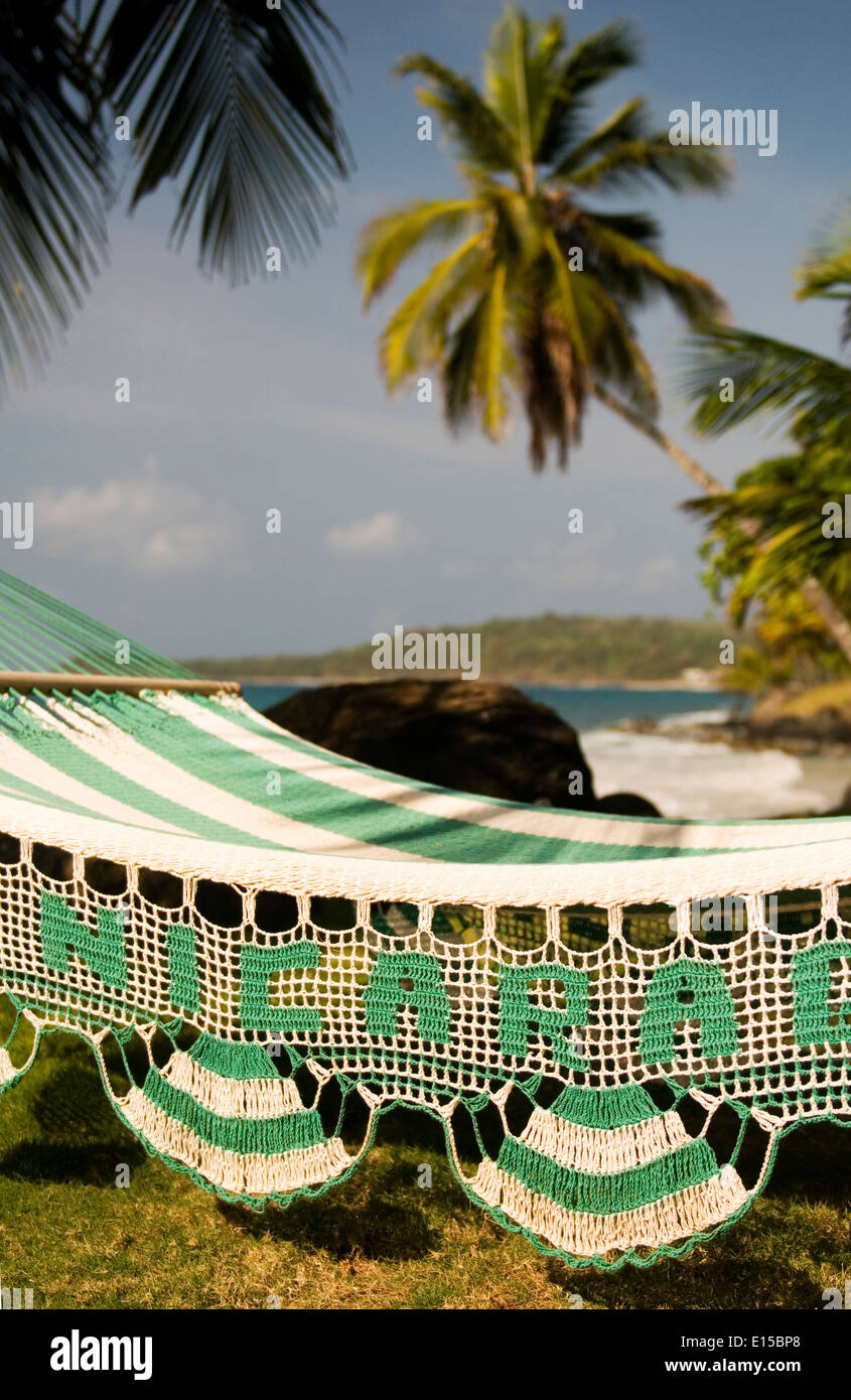 hammock with palm coconut trees on Caribbean Sea at CasaCanada resort Corn Island Nicaragua