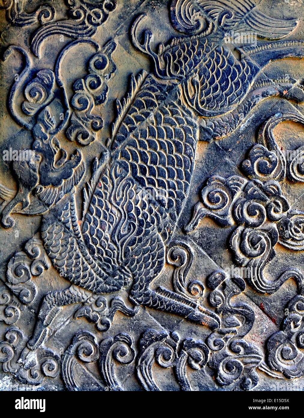 (140523) -- ZHENGZHOU, May 23, 2014 (Xinhua) -- Photo taken on May 24, 2010 shows the stone relief of a Qilin, an auspicious beast in Chinese mythology, at the Anguo Temple in Licun Township of Shanxian County, central China's Henan Province. A large number of architectural sculptures have been preserved in historical sites of Henan, which is one of the cradles of the Chinese civilization. Many of the sculptures, created from stones, bricks, or wood, were used as building parts of residences, shrines and memorial archways, among other architecture types. Underlining both the mood and the detai Stock Photo