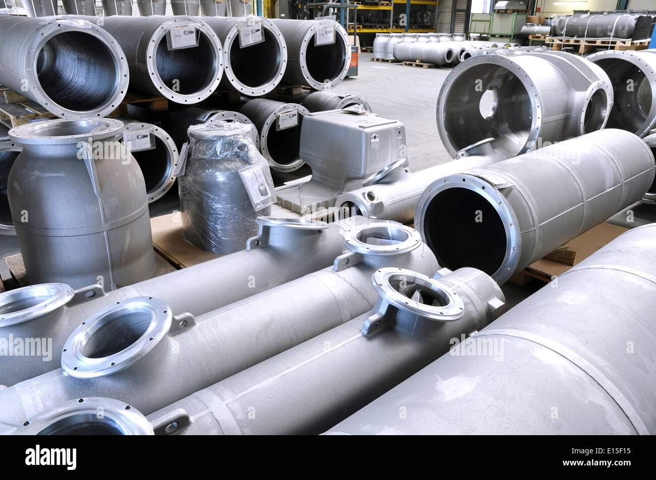 Cast iron pipes in a factory hall Stock Photo Alamy