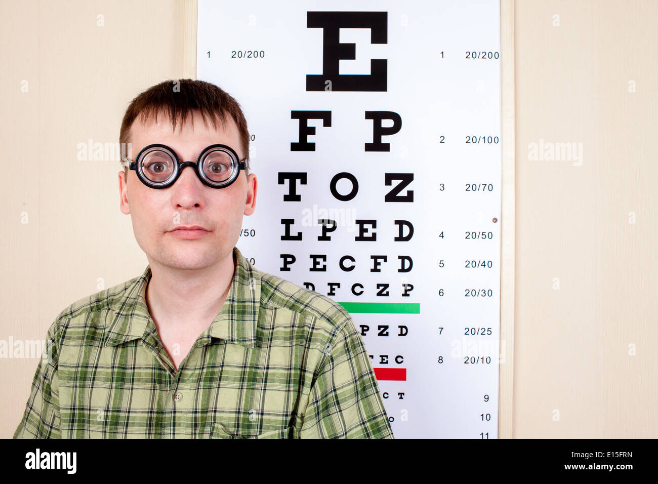 Funny man wearing spectacles in an office at the doctor Stock Photo Alamy