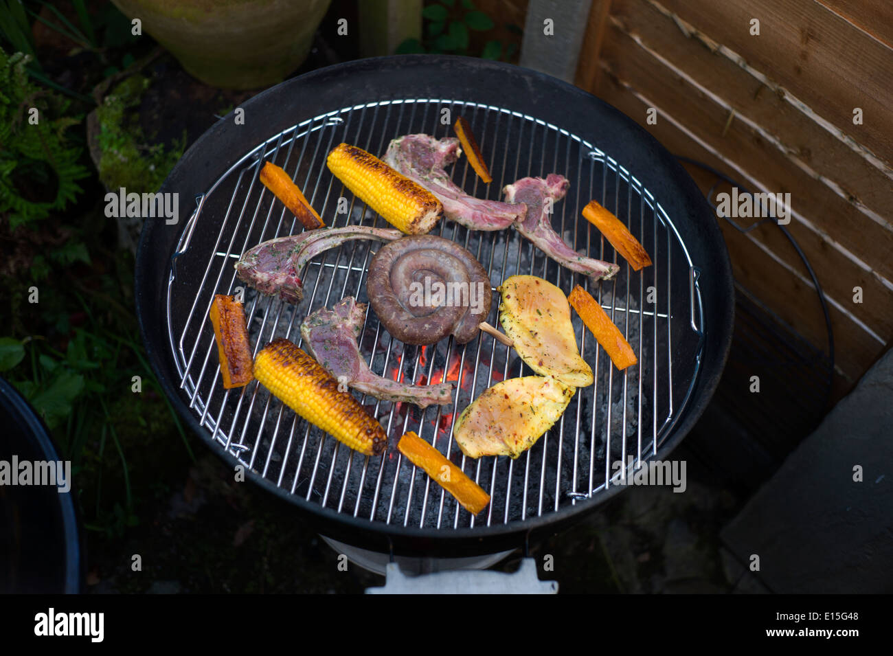 BBQ in garden, Thaxted Essex England UK. May 2014 Stock Photo Alamy