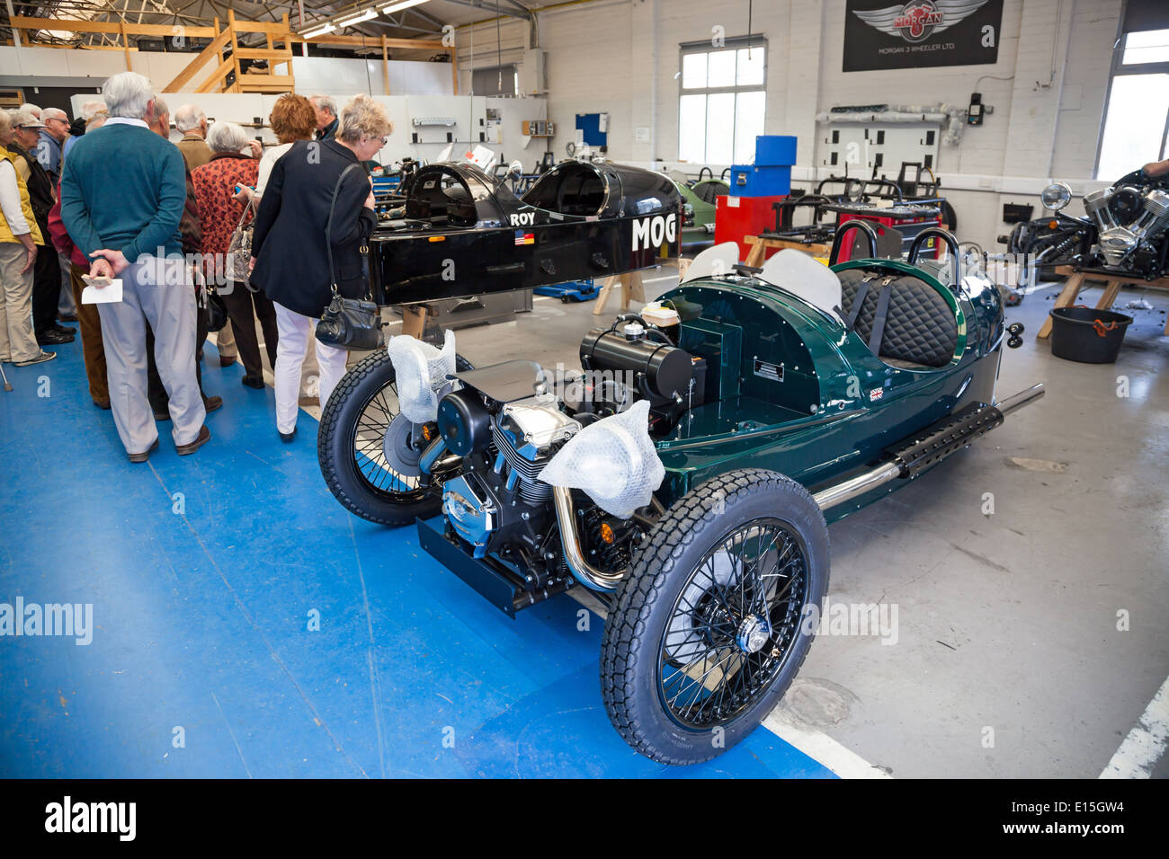 Cars being assembled by hand using Ash wood and Aluminium on the