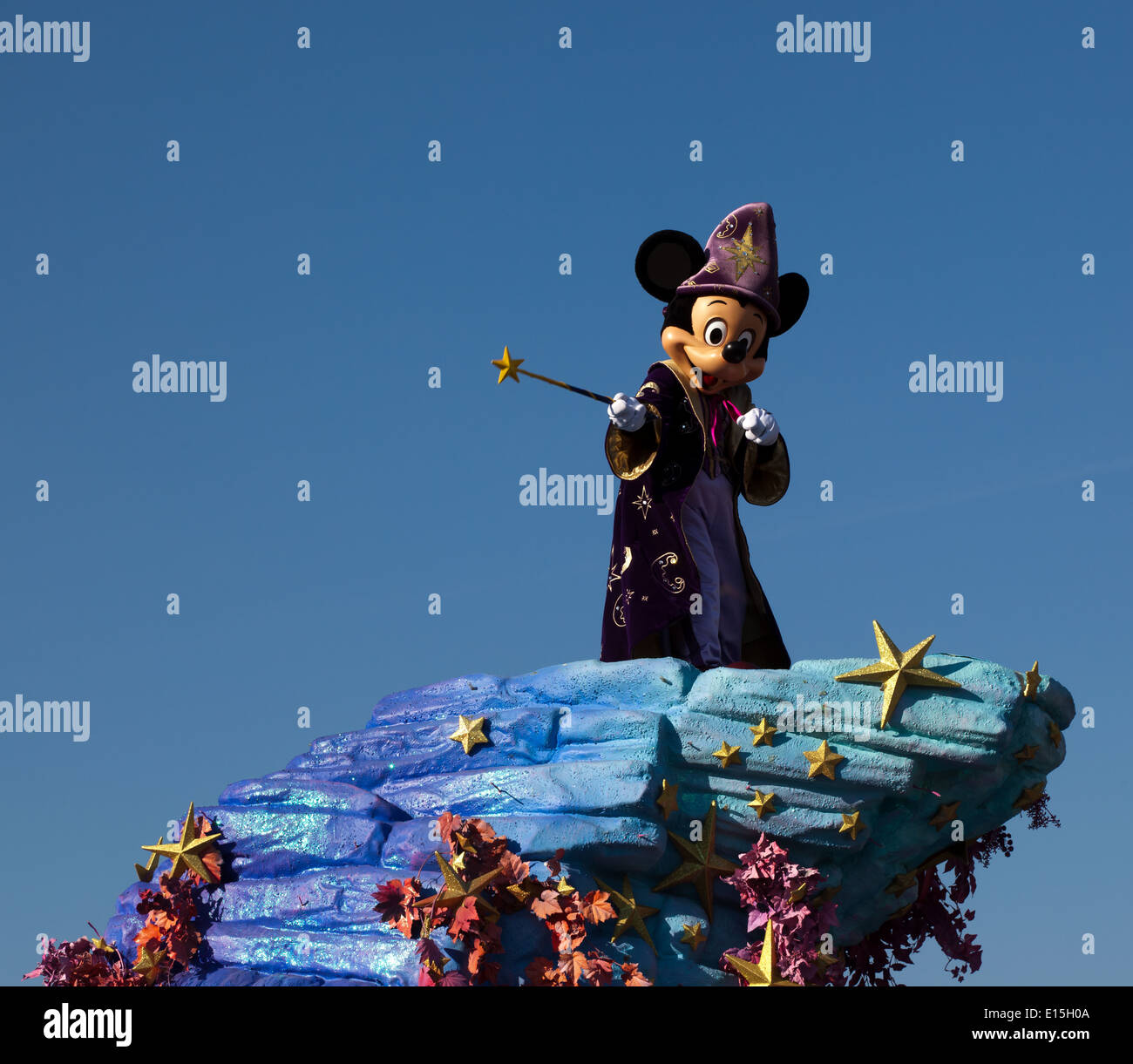 A Disney Parade with Micky Mouse dressed as  'The Sorcerer's Apprentice' from the Disney film Fantasia Stock Photo