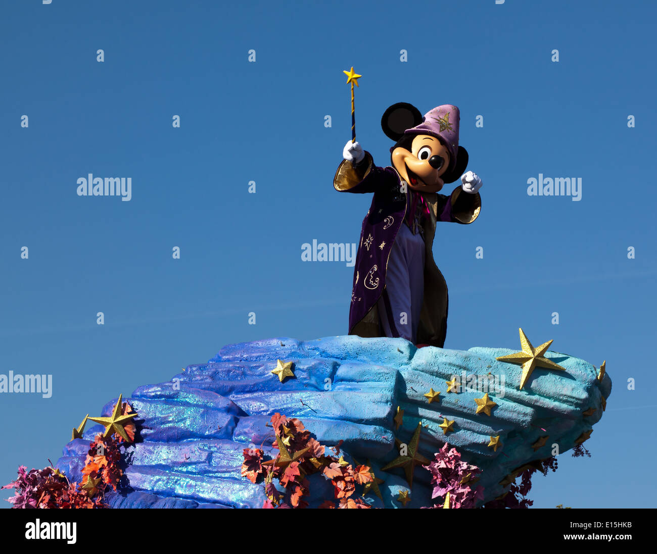 A Disney Parade with Micky Mouse dressed as  'The Sorcerer's Apprentice' from the Disney film Fantasia. Stock Photo