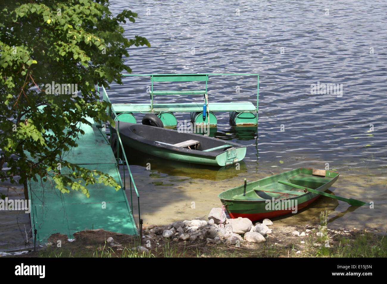 Small dock with boat tied up hi-res stock photography and images - Alamy