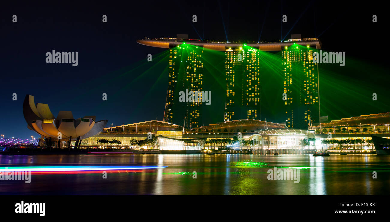 Marina Bay, Singapore - Apr 11 - Marina Bay Sands light show spectacular at dusk on April 11th 2014 Stock Photo