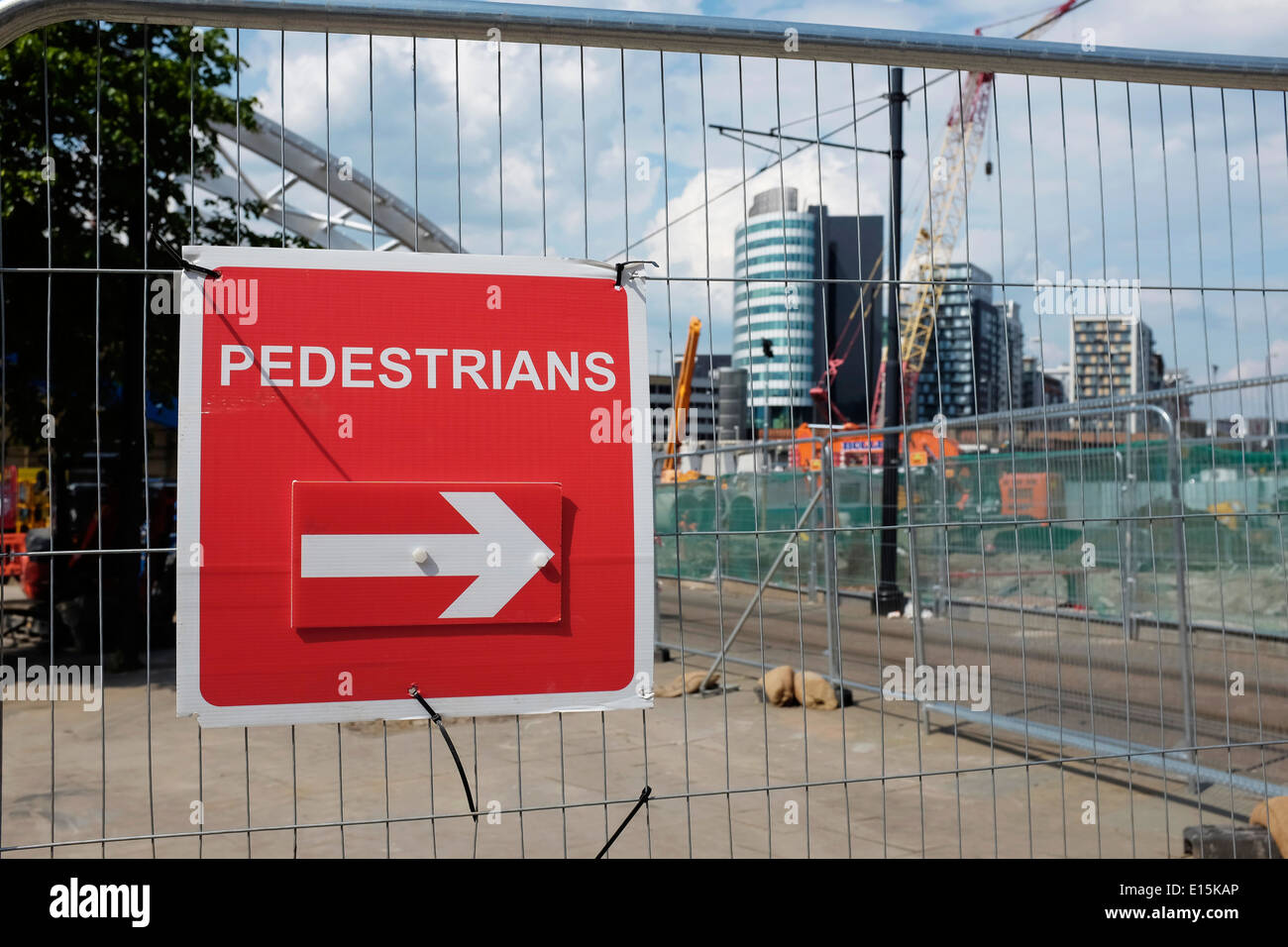 Pedestrian sign and heras fencing around works in Manchester city centre UK Stock Photo