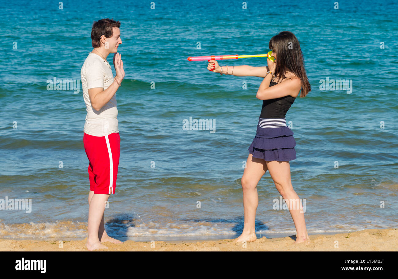 Atacking him with a dangerous summertime weapon Stock Photo