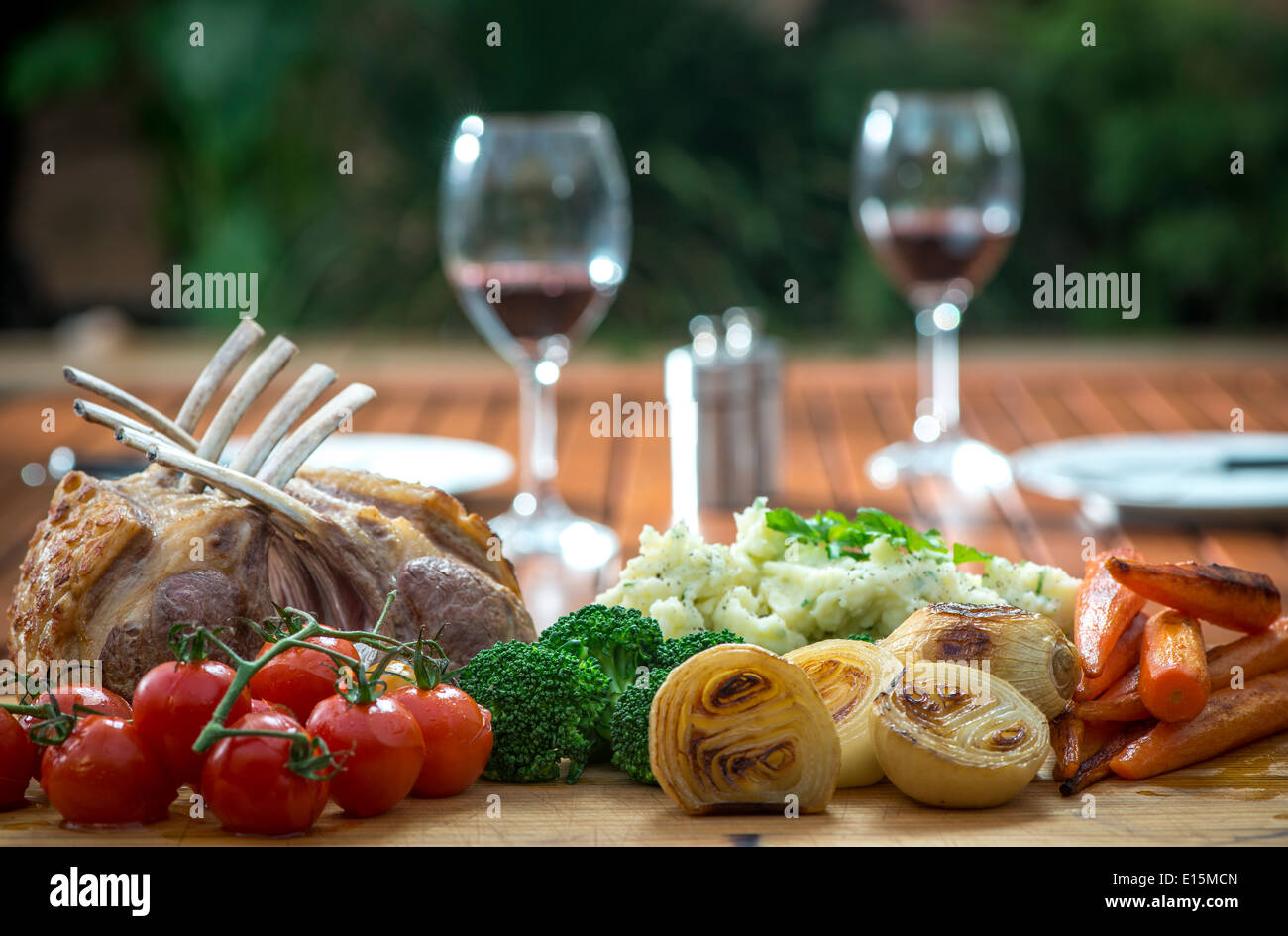 Roast Rack of Lamb with roasted mixed vegetables, onions, carrots