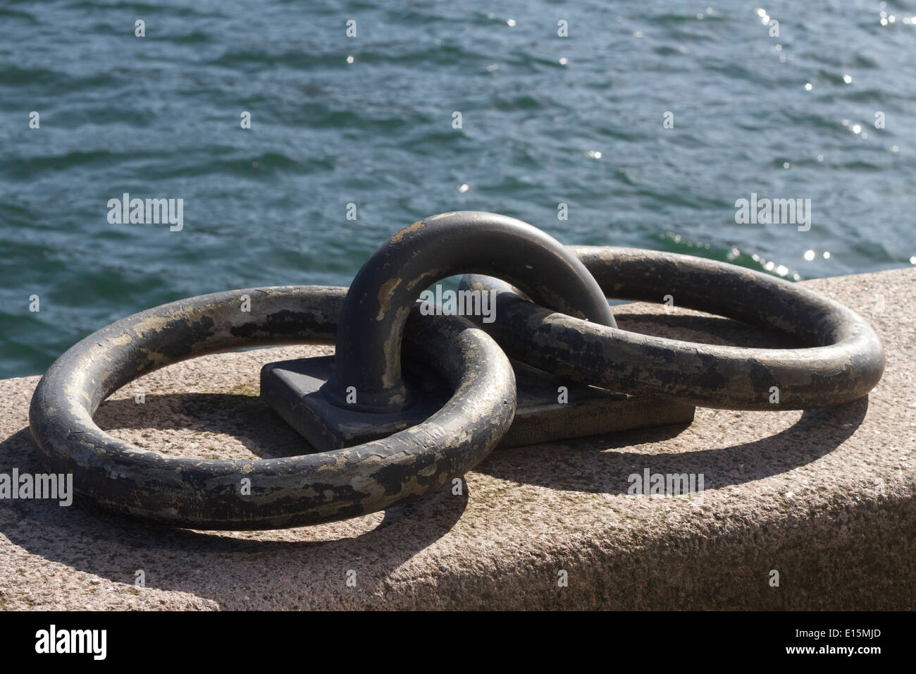 Mooring rings alongside the harbour near the Black Diamond in Copenhagen.  Iron links for tying up shipping in the harbour. Stock Photo