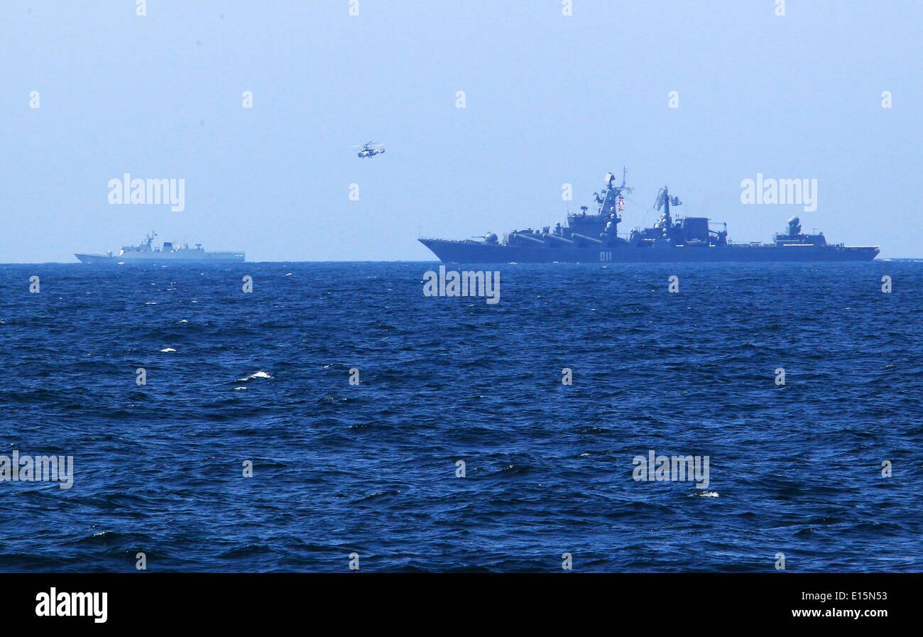 East China Sea. 23rd May, 2014. A Chinese navy helicopter carries out an investigation mission during a drill on East China Sea, May 23, 2014. The Chinese and Russian navies staged exercises, including joint escort drill, joint aircraft identification exercise and air defense and maritime assault drills, on the East China Sea on Friday to simulate anti-piracy operations. Credit:  Zha Chunming/Xinhua/Alamy Live News Stock Photo