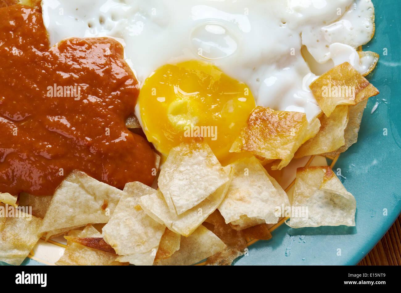 Huevos con chilaquiles Mexican traditional breakfast eggs. Eggs with