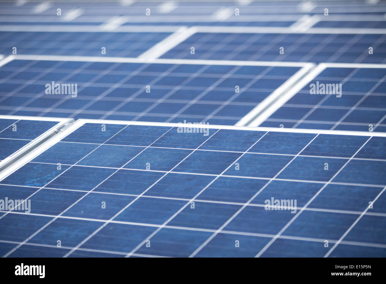 Solar Panels on a flat roof of an office block Stock Photo