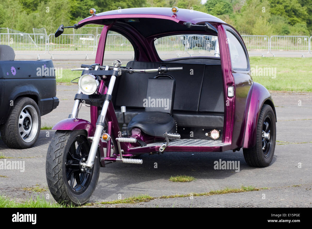 motorcycle frame attached to the back of a Volkswagen Beetle Stock Photo