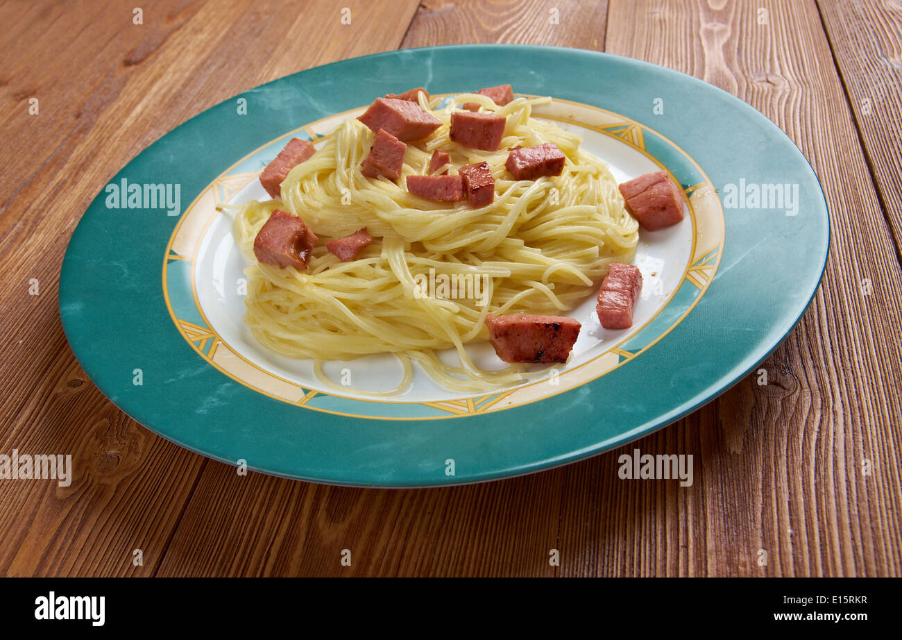 Capellini pasta with cream sauce Alfredo and sausage Stock Photo Alamy