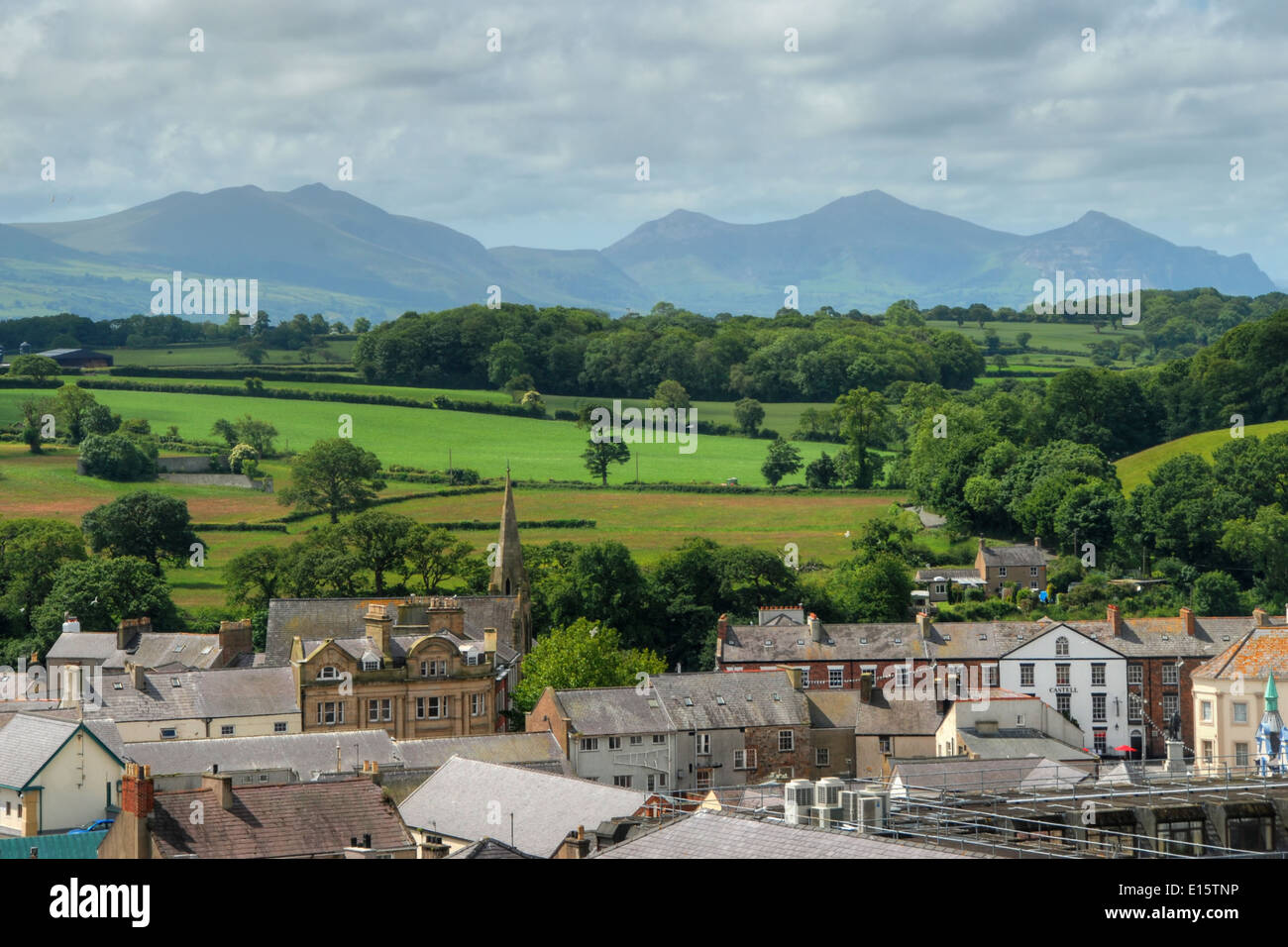 The outskirts of Caernarfon, with foothills of the Snowdonia Mountain Range in the distance Stock Photo