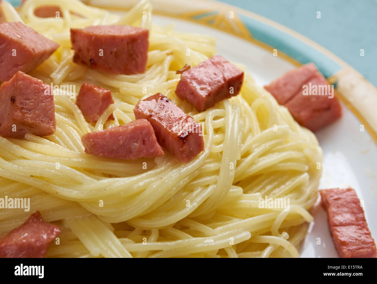 Capellini pasta with cream sauce Alfredo and sausage Stock Photo Alamy
