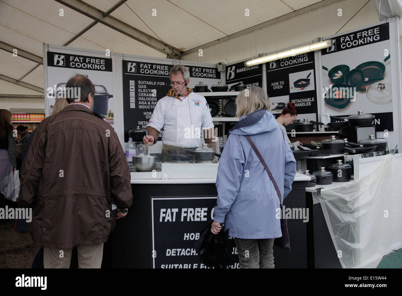 Vendor At Devon County Show Demonstrating Cooking With Fat - 