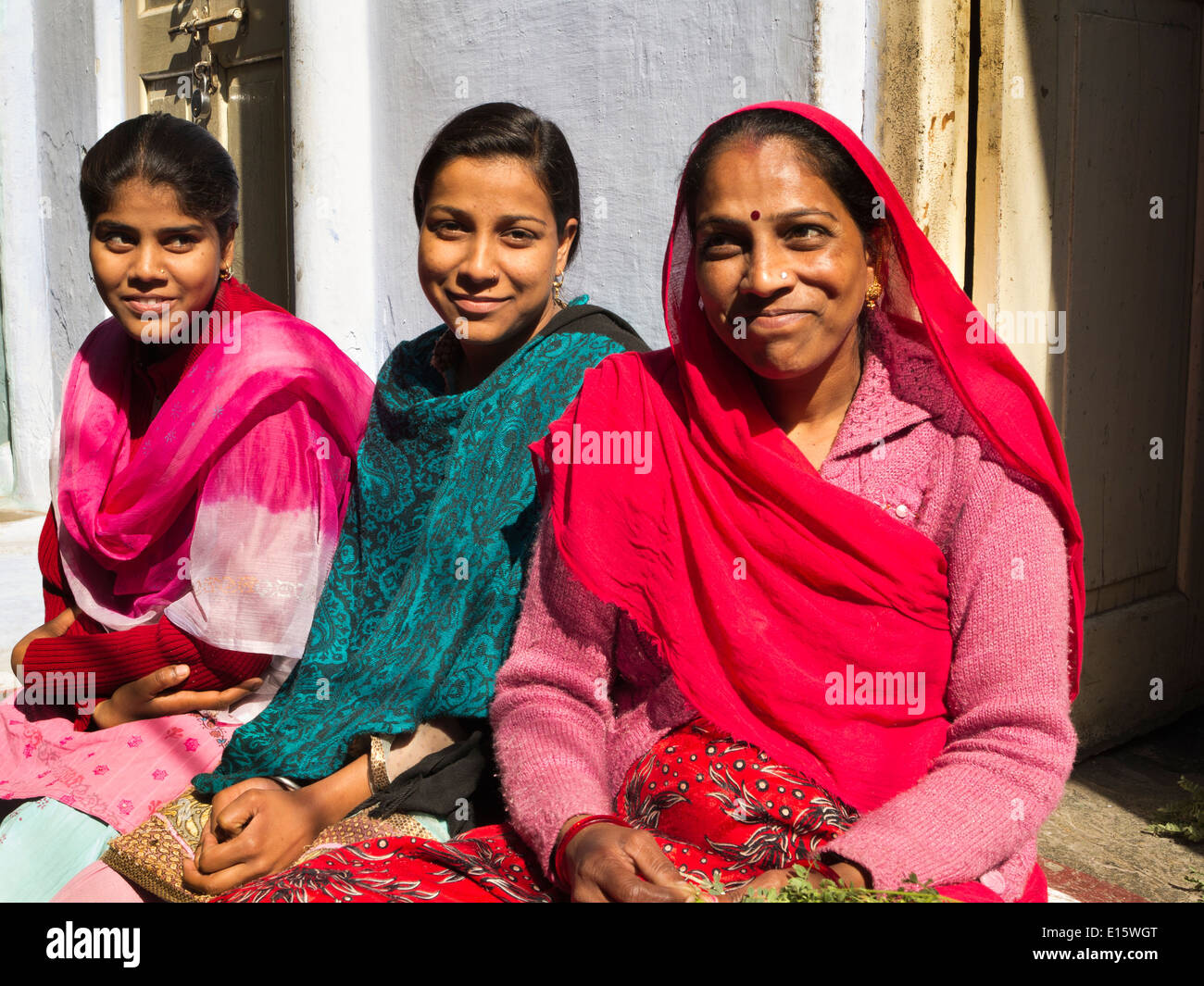 India, Rajasthan, Udaipur, Ghanta Ghar, women socializing in sunshine Stock Photo