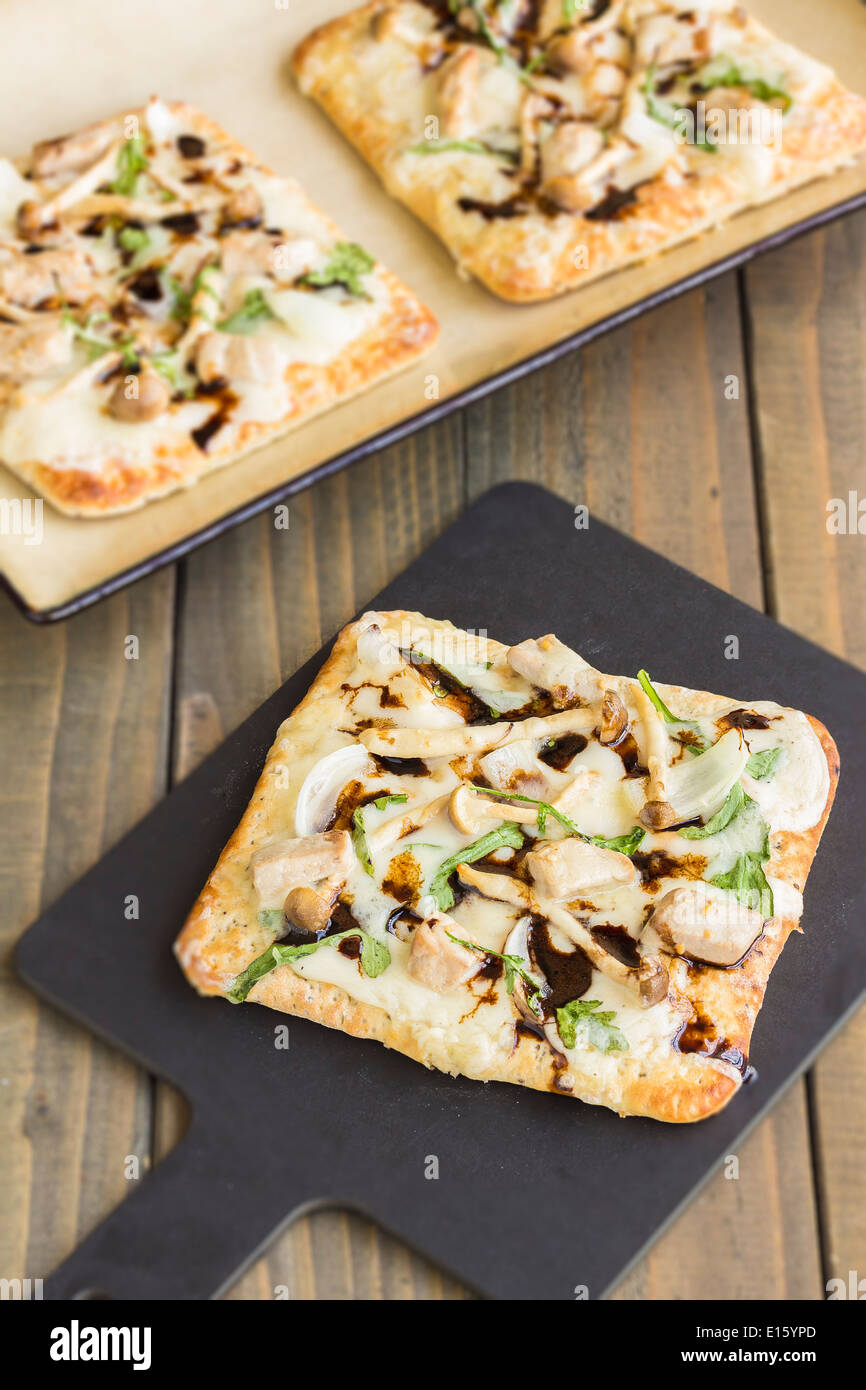 Chia flatbread with bechamel sauce, arugula, smoked havarti cheese