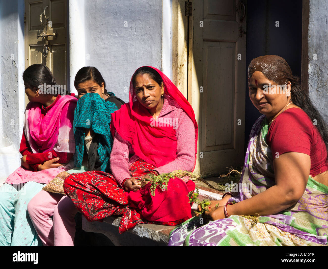 India, Rajasthan, Udaipur, Ghanta Ghar, women socializing in sunshine Stock Photo