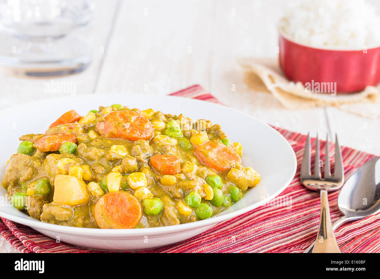 Curry stew made with ground beef, peas, carrots and corn, a common meal