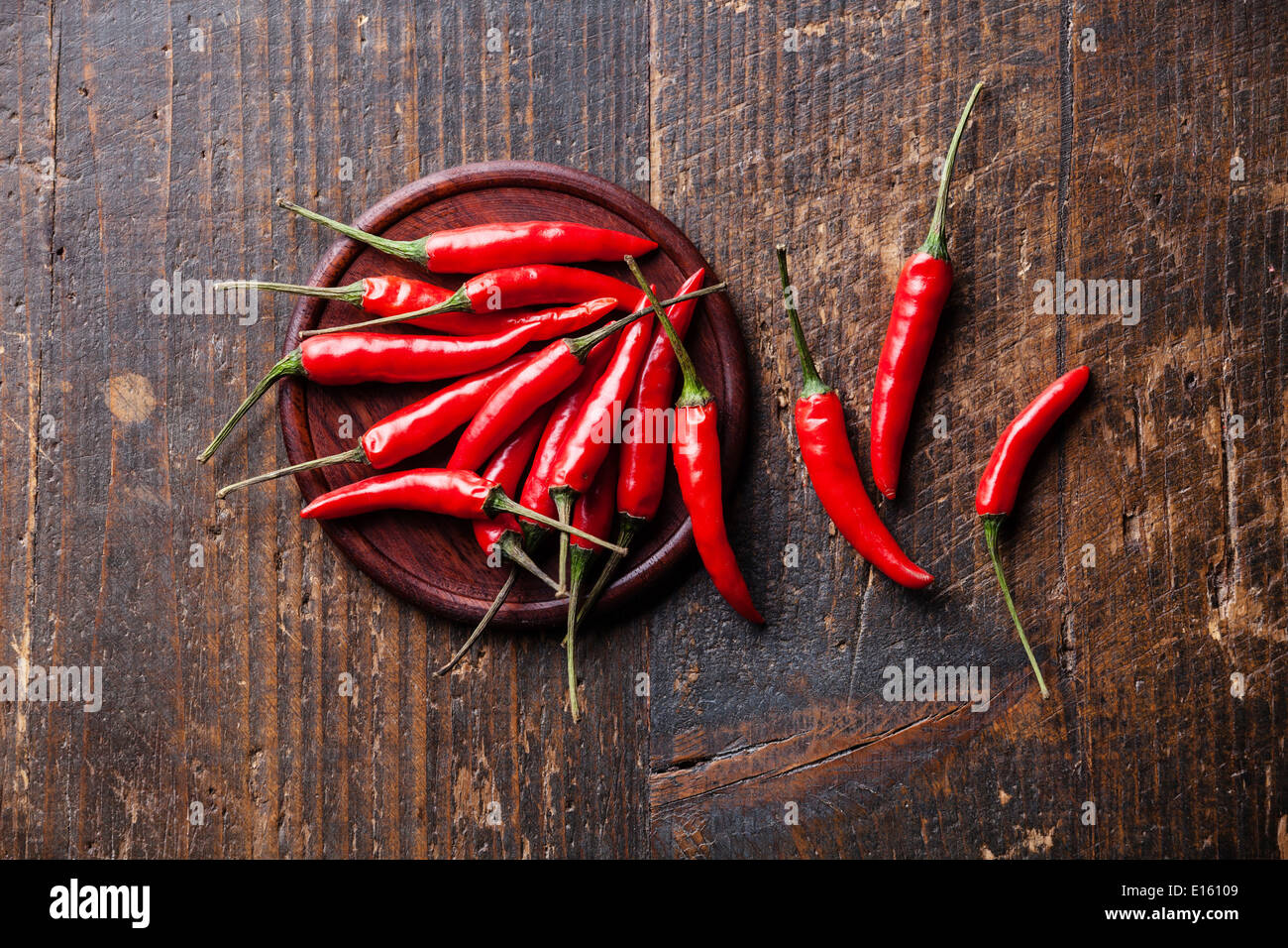 Red Hot Chili Peppers on wooden background Stock Photo