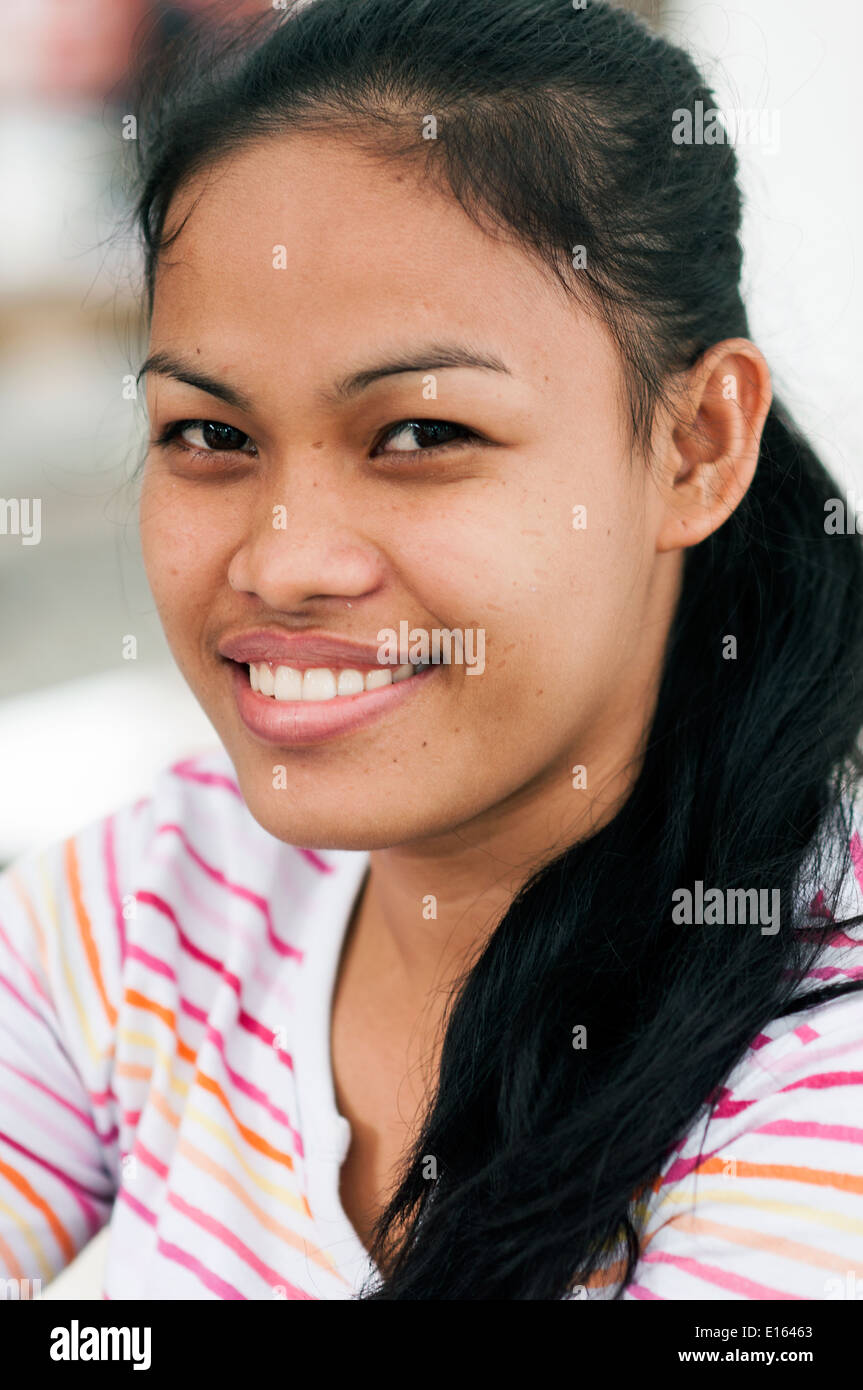 young woman in plaza, Butuan, Philippines Stock Photo