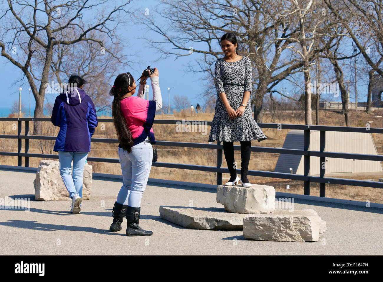 Young lady posing for a photo on a mild early spring day in Lincoln Park, Chicago. Stock Photo