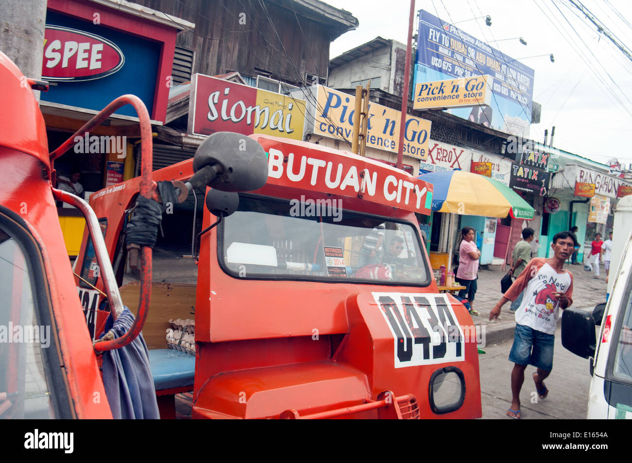 tricycle taxis in downtown Butuan, Mindanao, Philippines Stock Photo ...