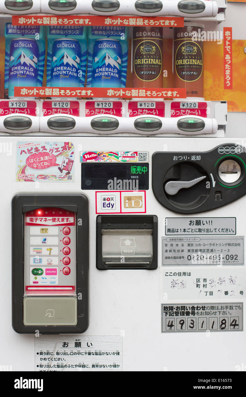 Can Drinks vending machine in Tokyo Japan that accepts coins but also payments from a wide range of prepaid cards and phones Stock Photo