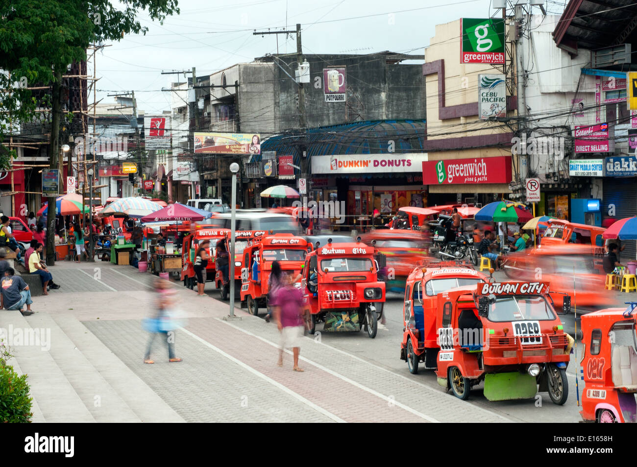 tricycle taxis in downtown Butuan, Mindanao, Philippines Stock Photo