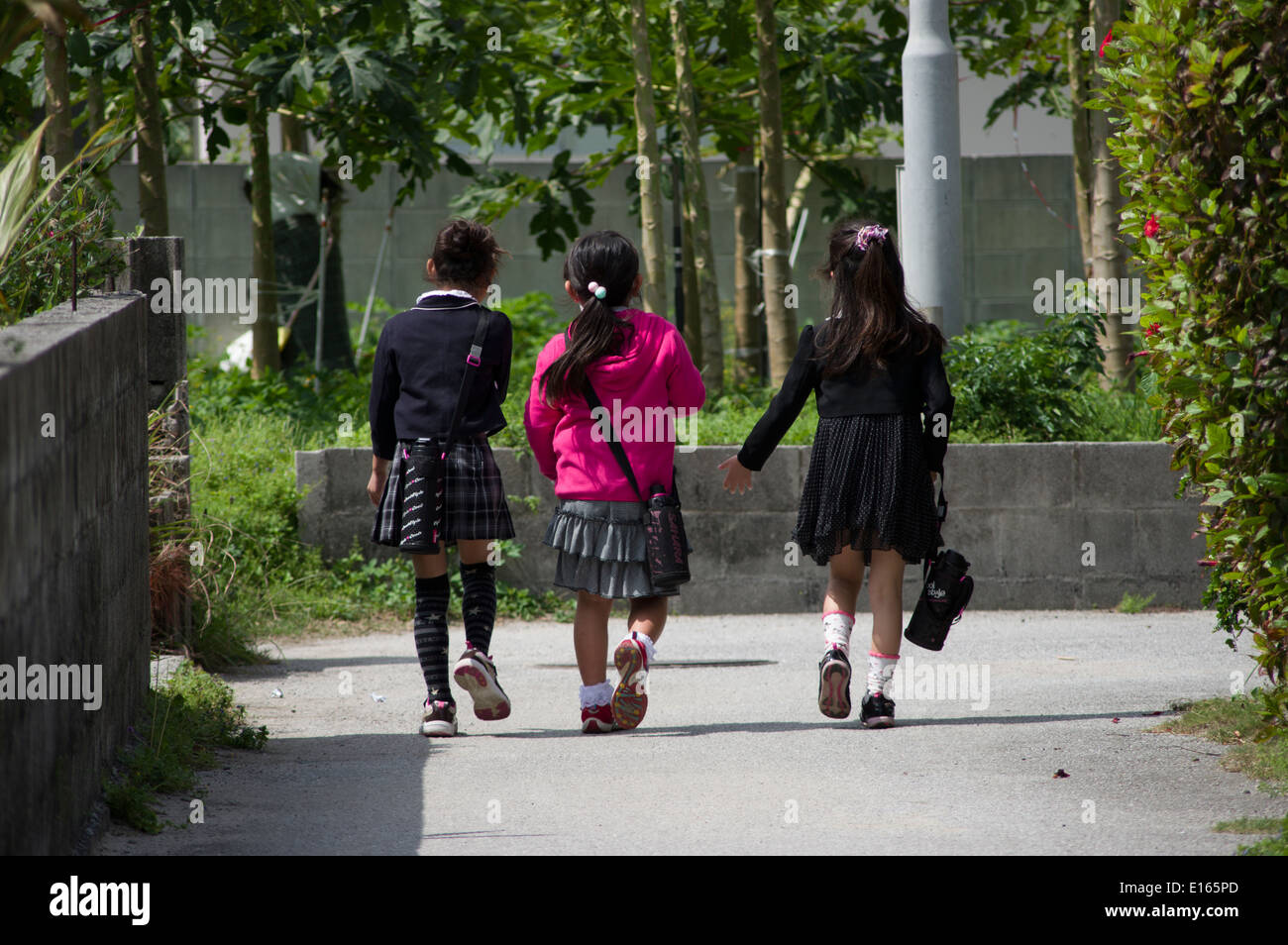 Japanese Elementary school children walking home from school, Zamami Island, Okinawa, Japan Stock Photo