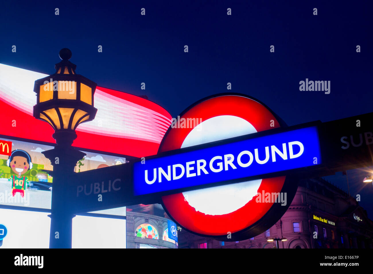 Piccadilly Circus London Tube Underground sign and neon advert advertising screens board London England UK Stock Photo
