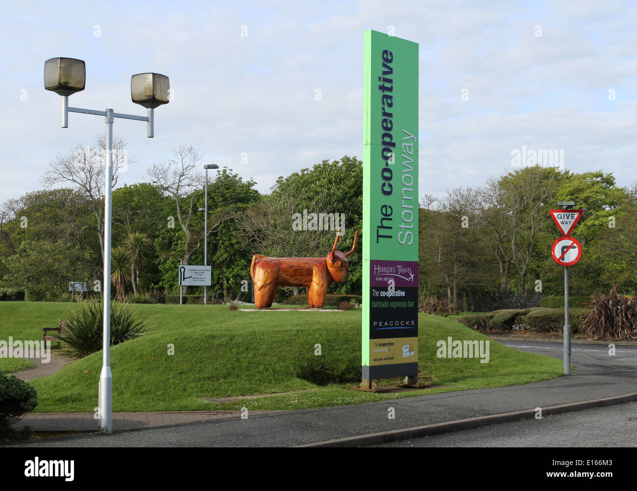 Cooperative supermarket sign wooden highland cow carving Stornoway