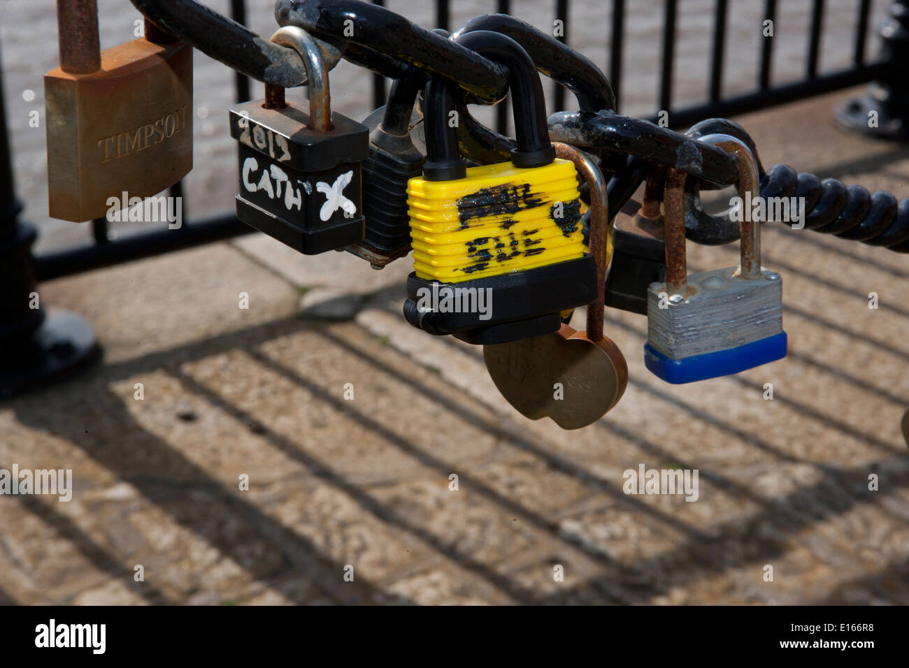Some of the thousands of padlocks on railing beside the River Mersey in