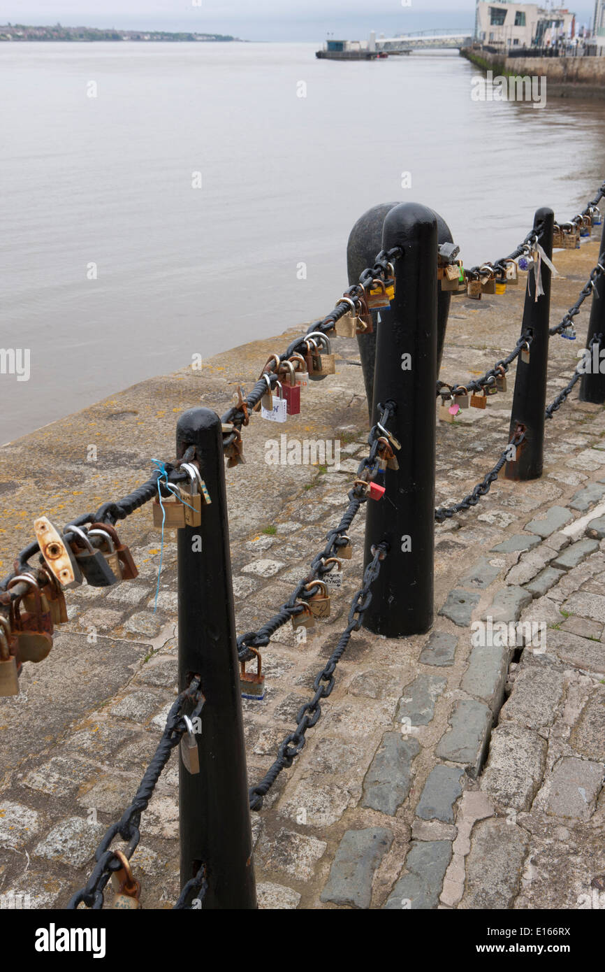 Some of the thousands of padlocks on railing beside the River Mersey in