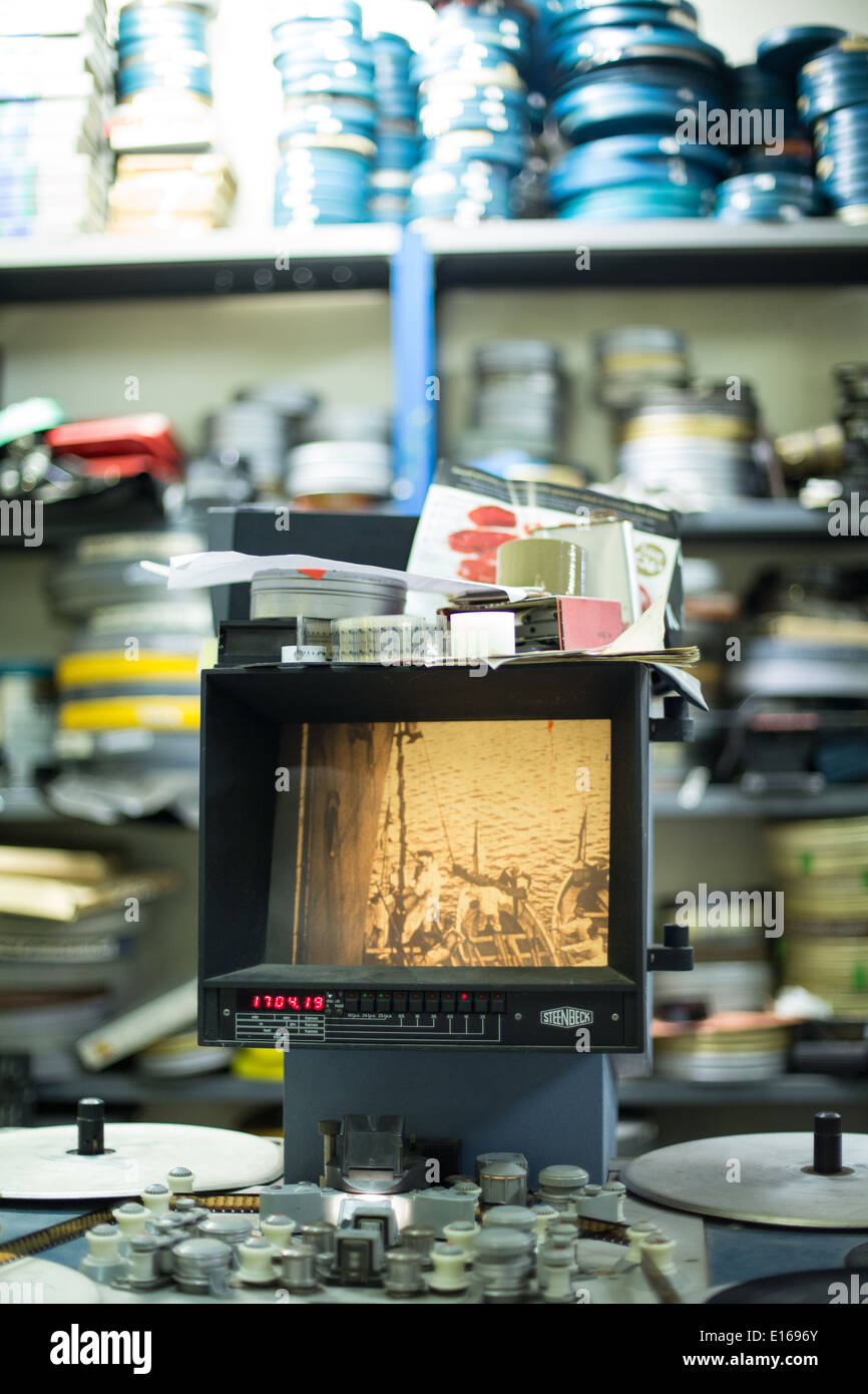 old sepia film showing on a steenbeck editing machine table with film