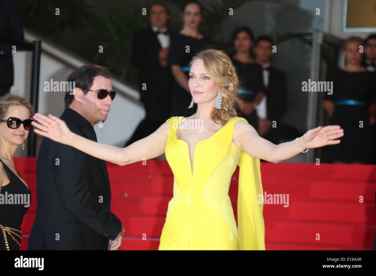 Cannes, France. 23rd May, 2014. Actors John Travolta (L) and Uma Thurman attend the premiere of 'Sils Maria' during the 67th Cannes International Film Festival at Palais des Festivals in Cannes, France, on 23 May 2014. Photo: Hubert Boesl -NO WIRE SERVICE- Credit:  dpa picture alliance/Alamy Live News Stock Photo