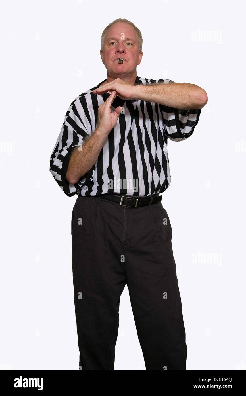 Man dressed as a basketball referee giving signal for technical foul Stock Photo