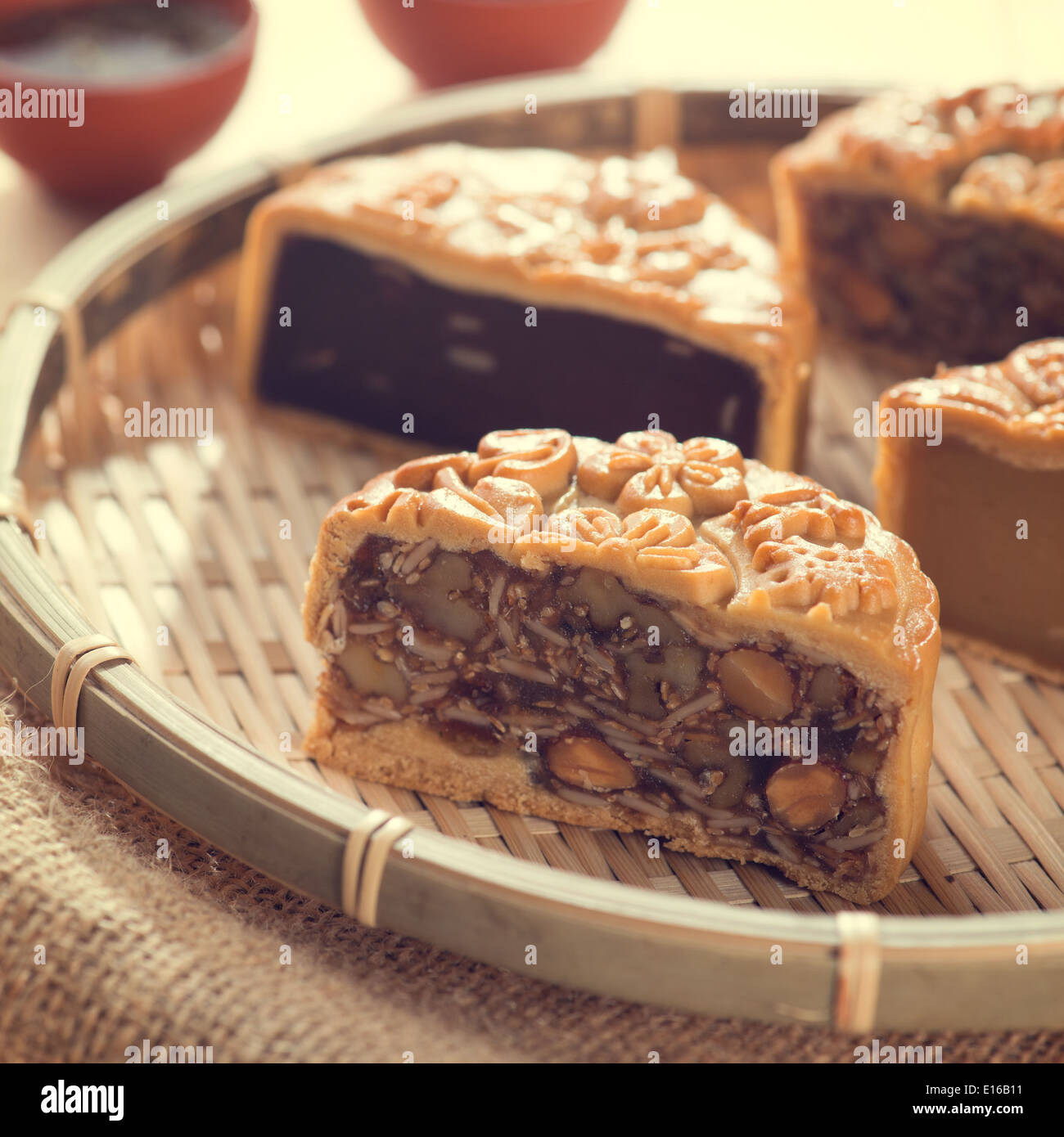Chinese mid autumn festival foods. Traditional mooncakes on bamboo tray ...
