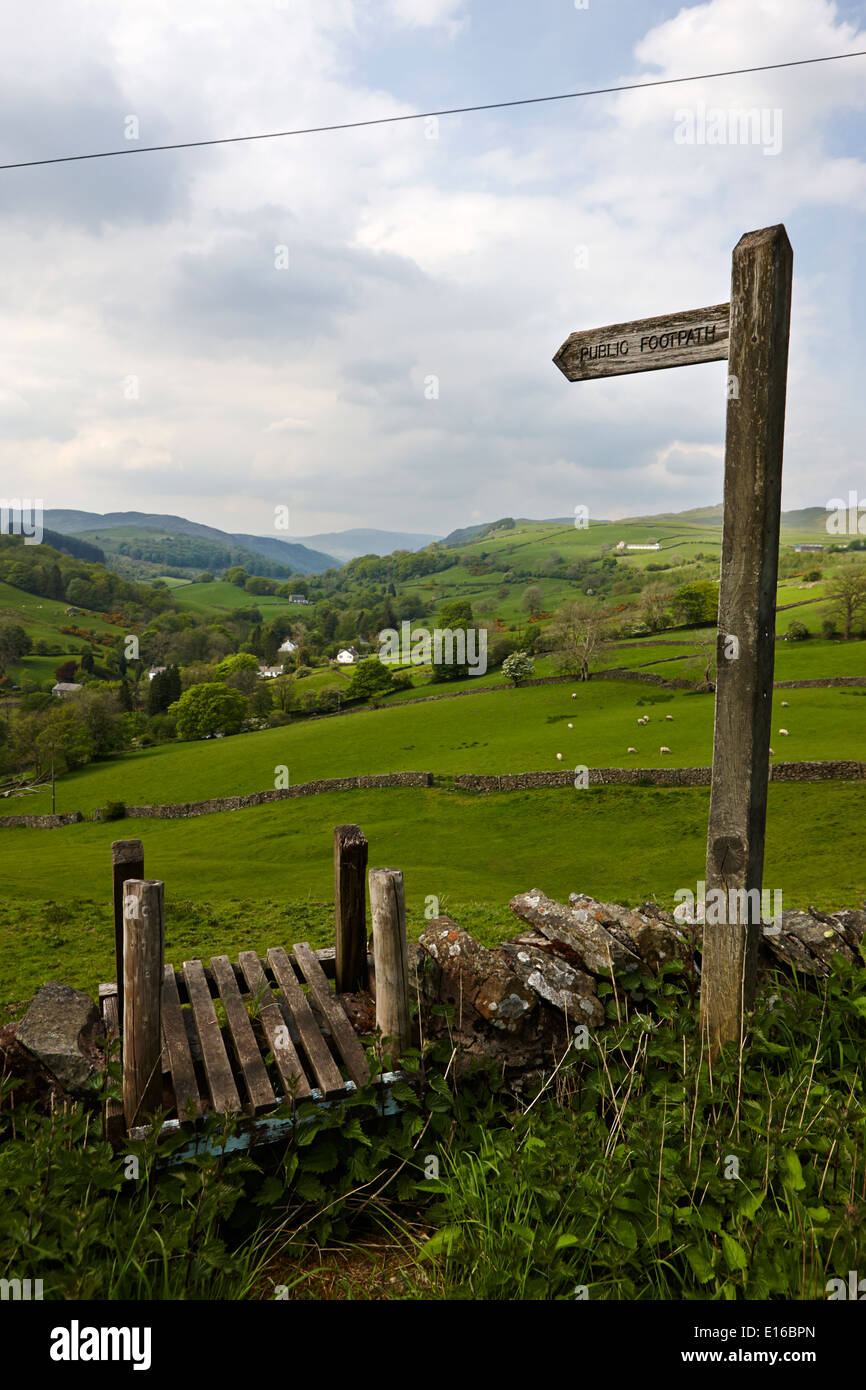 wooden public footpath sign and stile longsleddale valley cumbria uk Stock Photo
