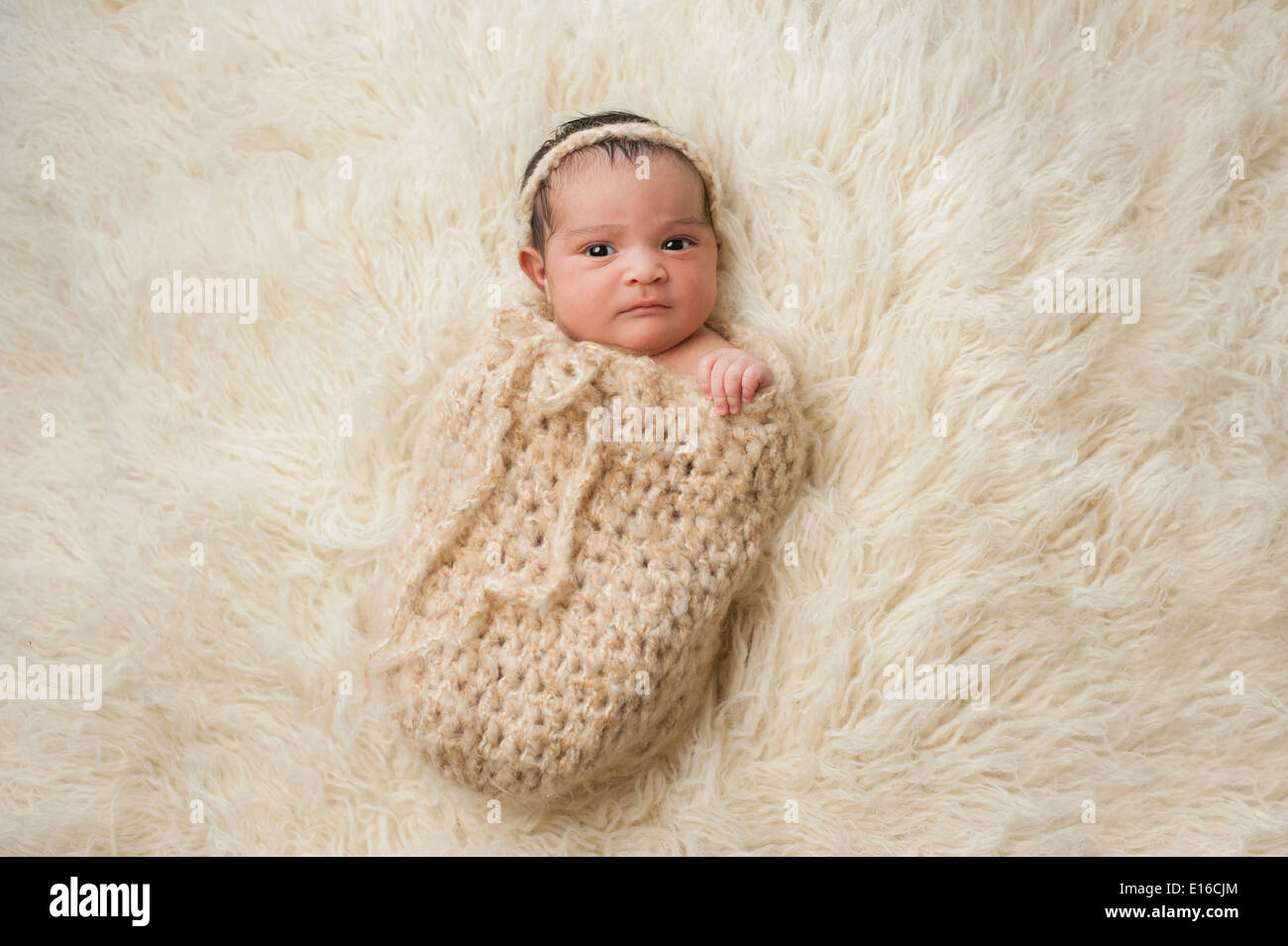 Baby girl with a displeased look on her face. Stock Photo