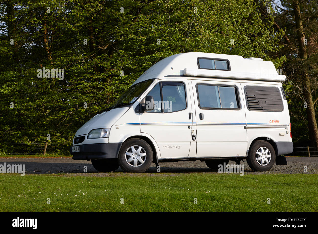 old ford transit campervan parked off the beaten track in layby on rural route in northumberland uk Stock Photo