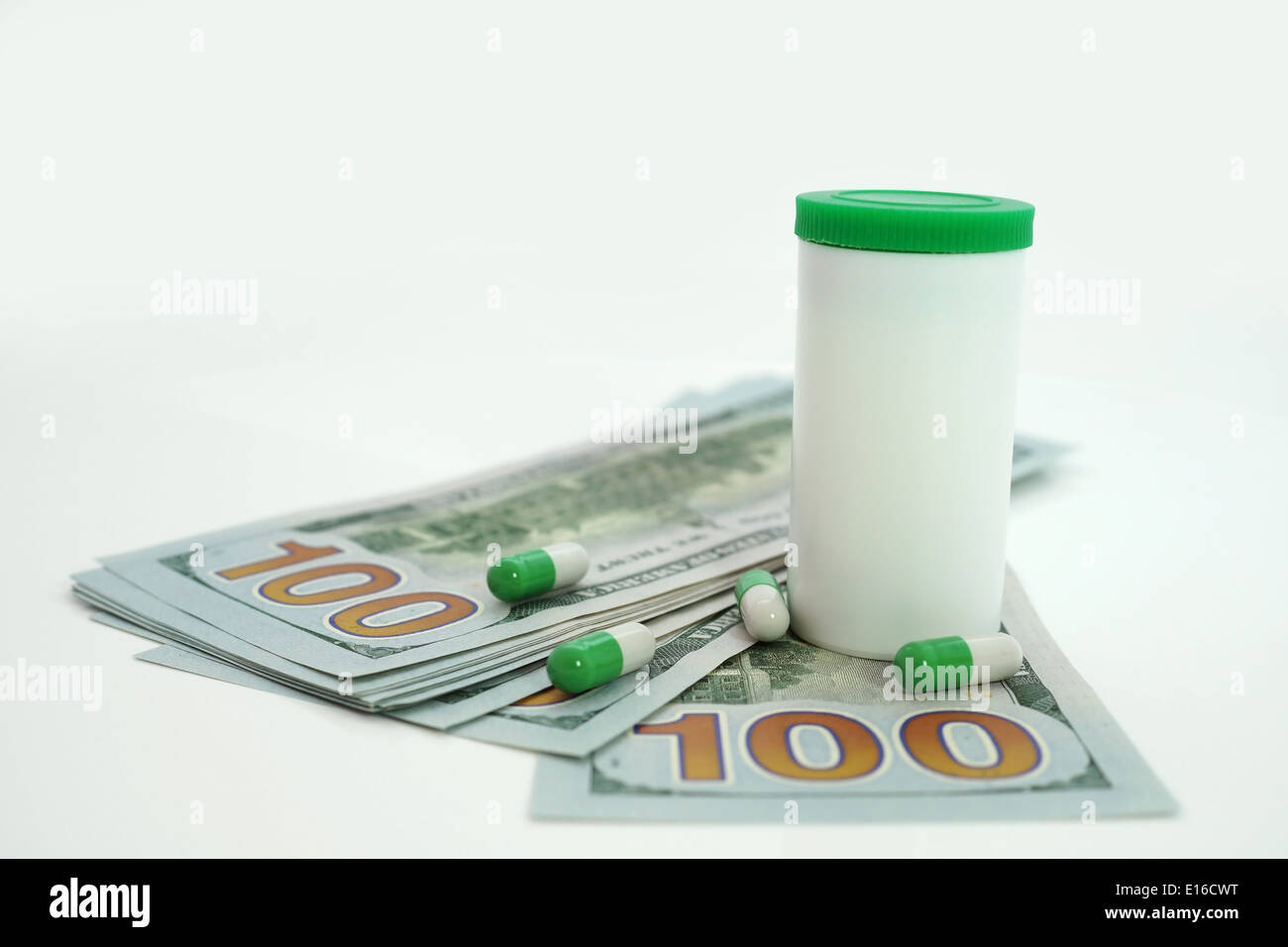 Medical tablets and dollars. Health care cost. Stock Photo