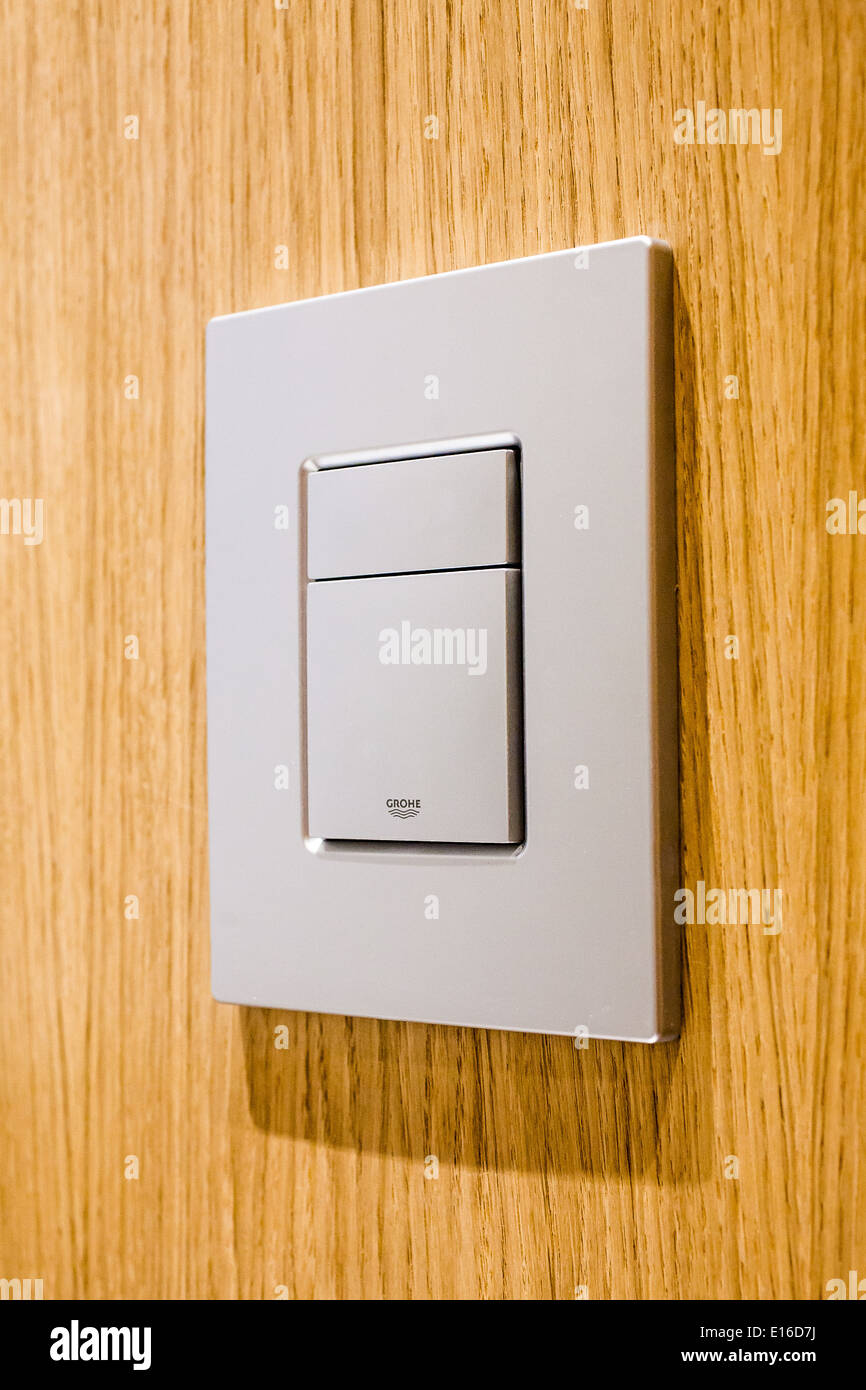 Modern toilet flush in bathroom in modern home, London, UK Stock Photo