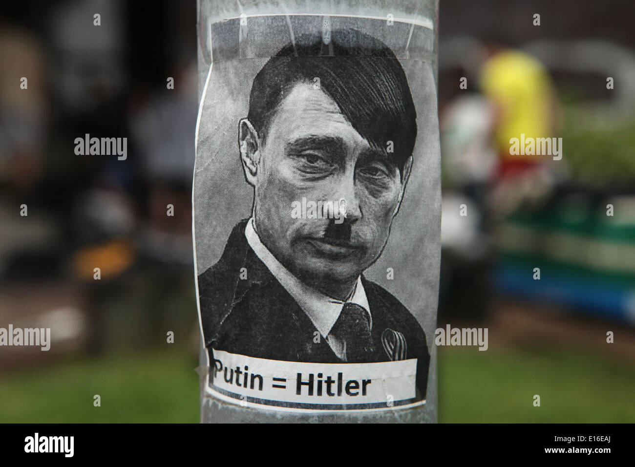 Sticker depicting Russian president Vladimir Putin as Adolf Hitler and with an equals sign between their names seen in Prague, Czech Republic. Stickers depicting Russian president Vladimir Putin with characteristic haircut and toothbrush mustache of Adolf Hitler have appeared in the different places in Prague, Czech Republic. Stock Photo